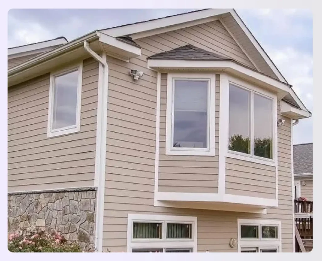 A two-story bump-out addition with a bay window