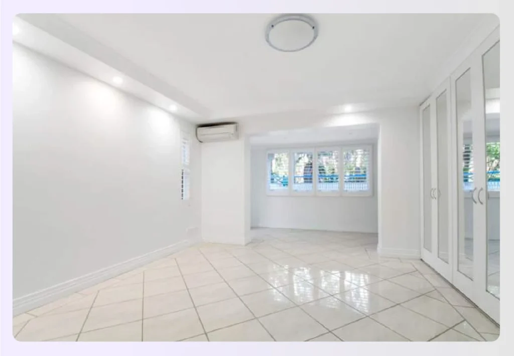 Bright empty room with glossy white tile floors