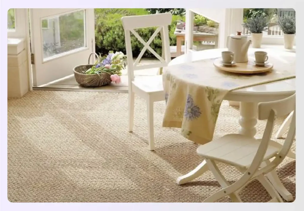 Sunlit dining nook with natural seagrass carpet