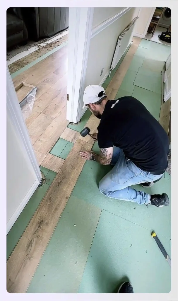 Laying down underlayment for laminate flooring