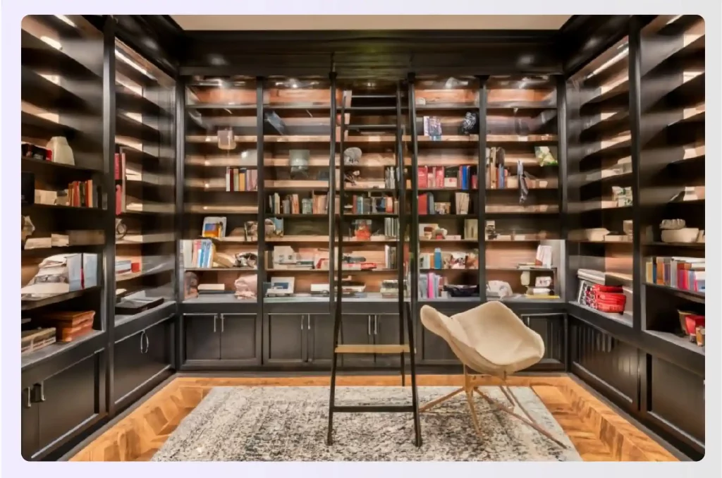 A floor-to-ceiling library with a rolling ladder for access