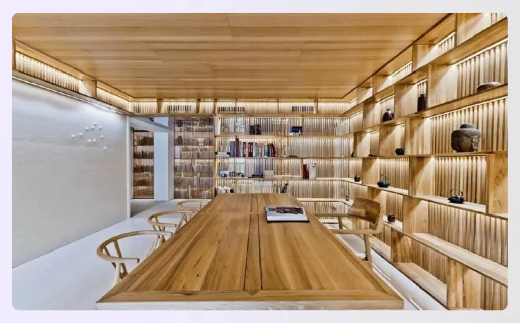 A study room with extensive wooden shelving
