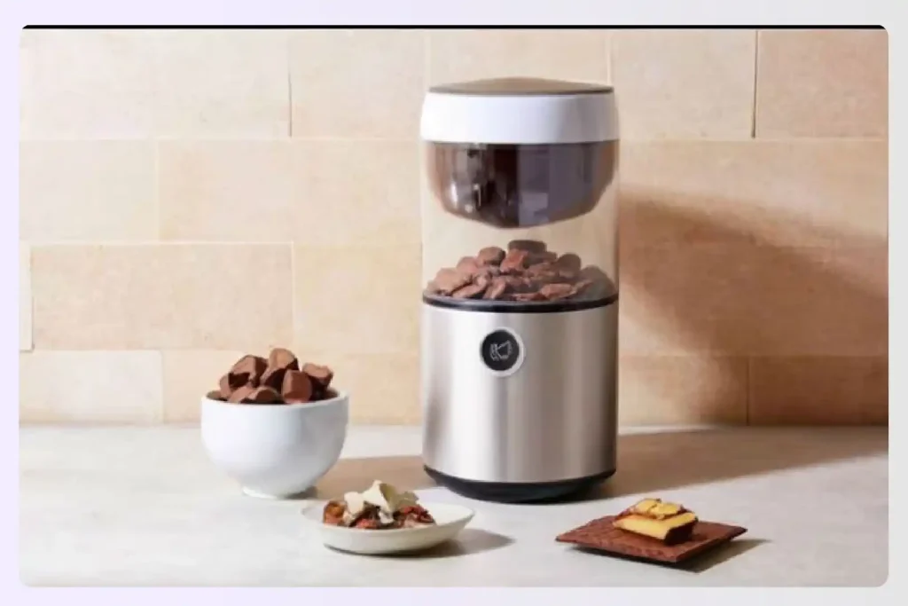 An automatic candy dispenser on a kitchen counter