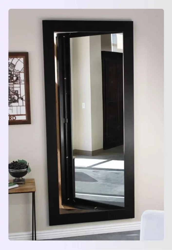 Elegant foyer mirror concealing secret room entrance