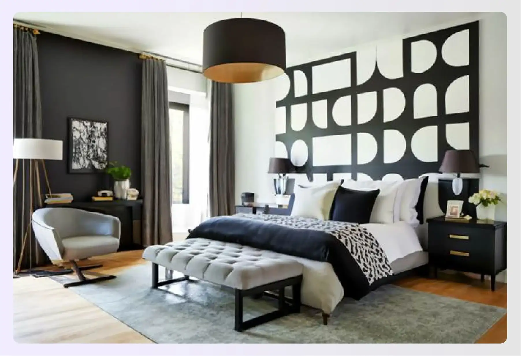 Graphic black and white bedroom with green hints