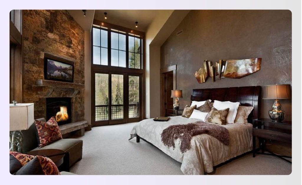 Luxurious rustic bedroom with stone fireplace and high ceilings Luxurious rustic bedroom with stone fireplace and high ceilings