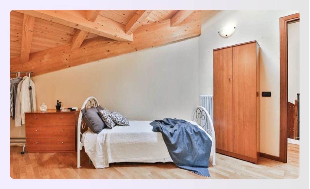 Minimalist rustic bedroom with sloped wooden ceiling rafters Minimalist rustic bedroom with sloped wooden ceiling rafters