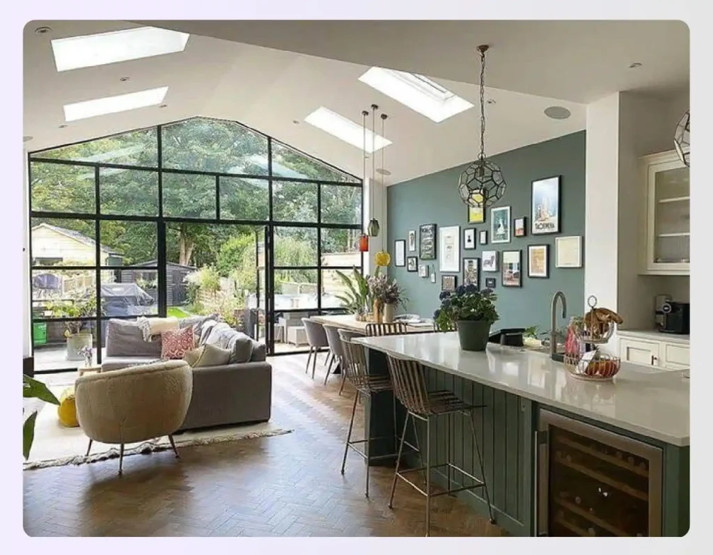 Open living area with multiple skylights in ceiling