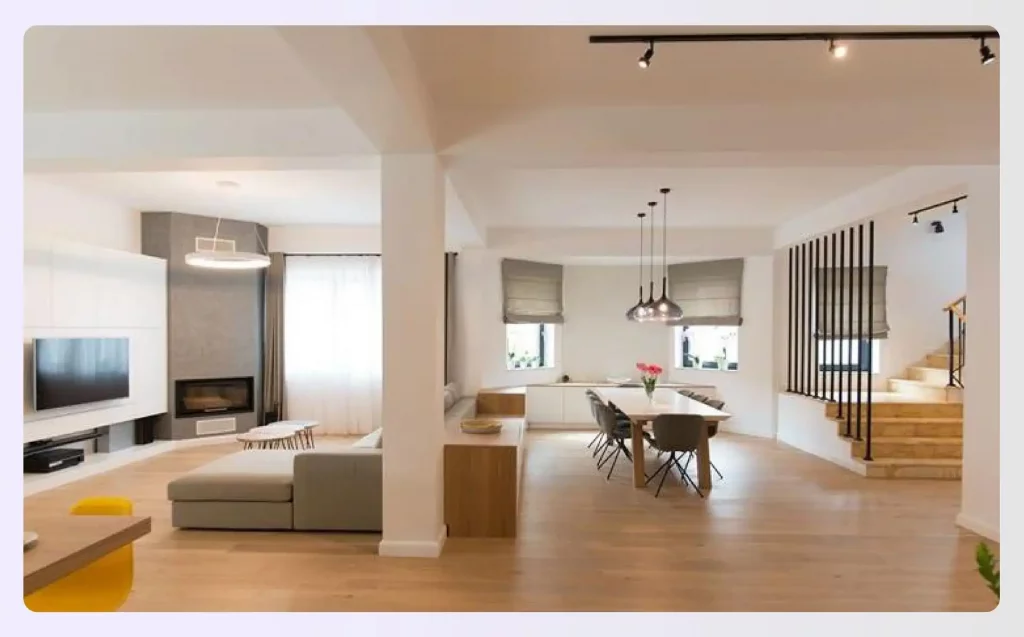 Open-plan living room with light wood floors