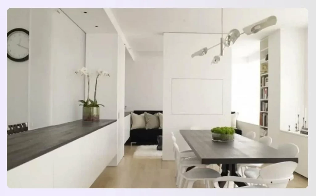 Sleek minimalist dining area with orchids