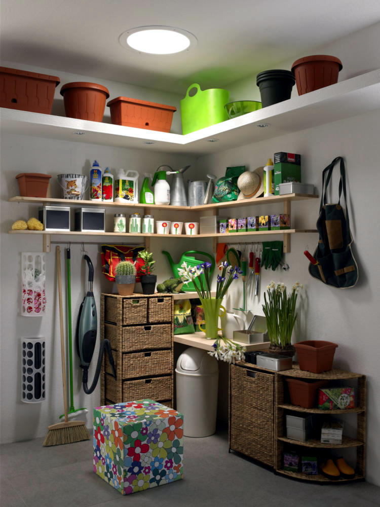Storage Room with gardening tools, shelves, and a wicker ottoman.