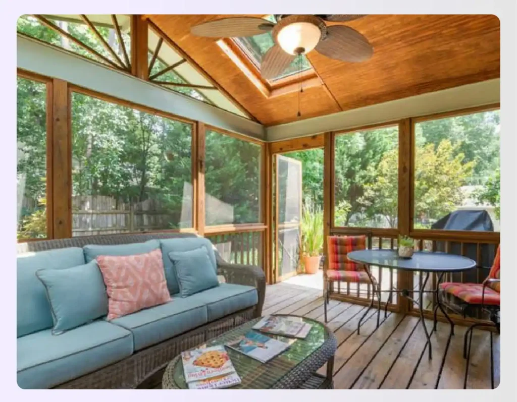 Sunroom with natural wood and neutral color furniture