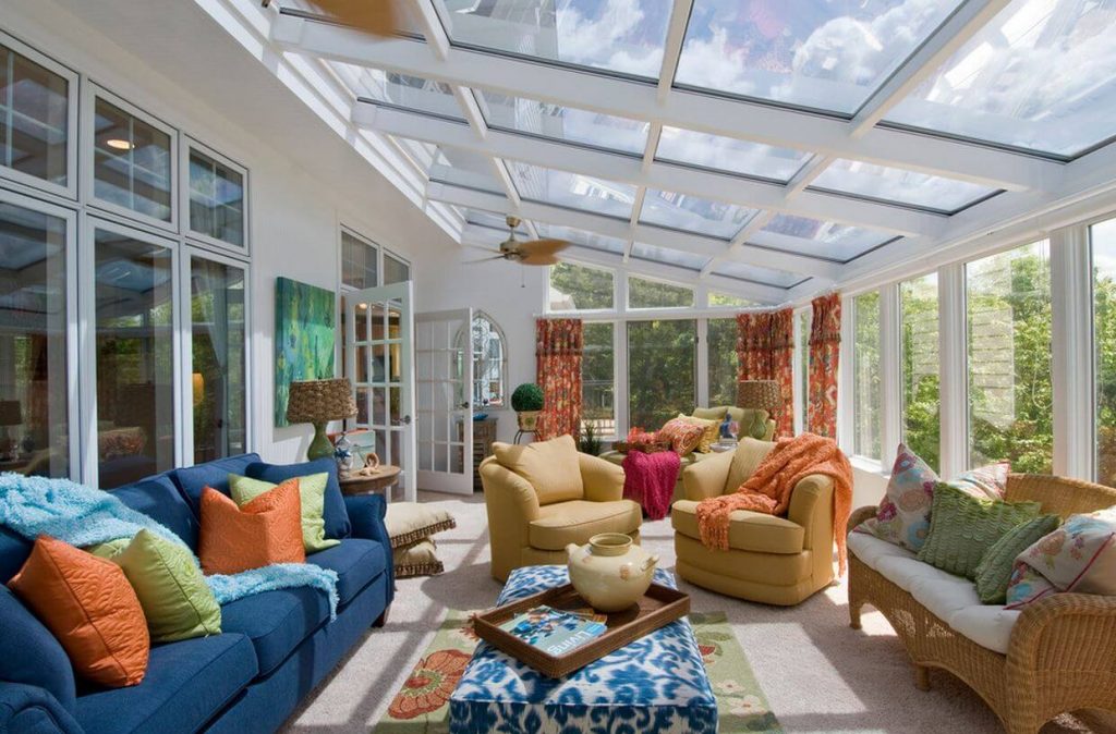 A bright and airy sunroom with a glass ceiling and plenty of natural light.