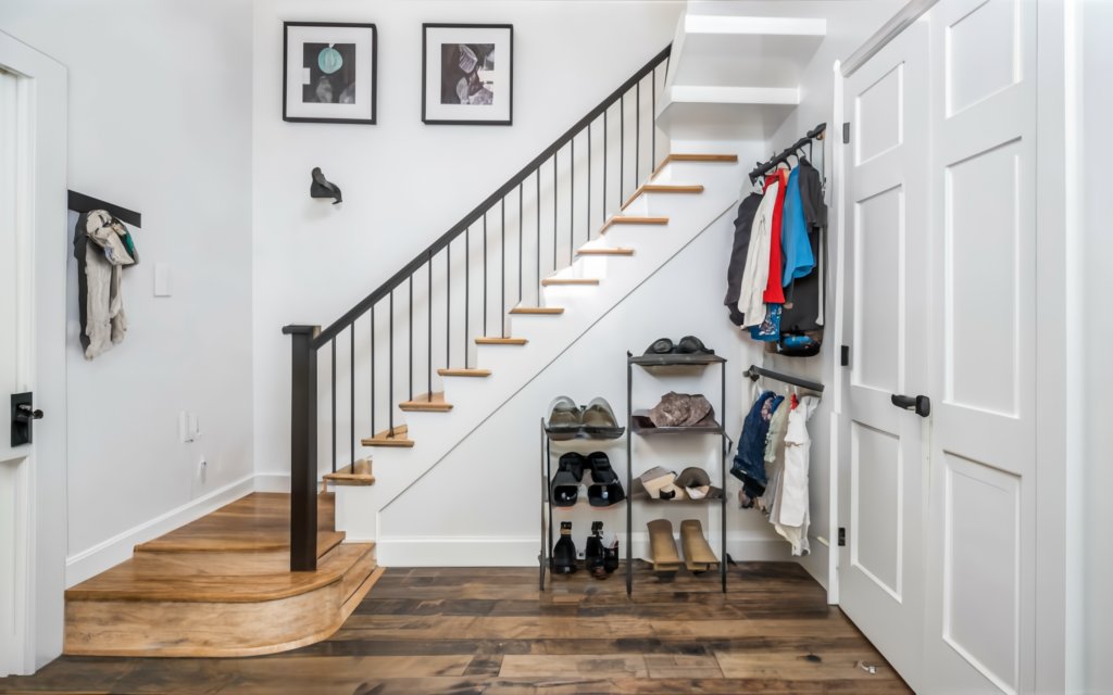 Use the Space Under the Stairs If Your Mudroom is Close to It