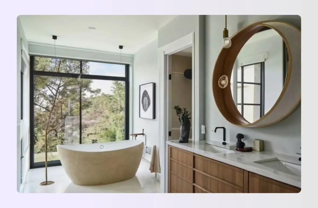 Freestanding bathtub placed near floor-to-ceiling window Freestanding bathtub placed near floor-to-ceiling window
