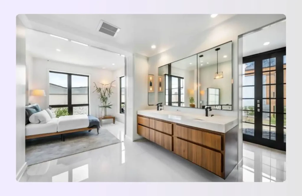 Glass partition separating bedroom from modern open bathroom vanity