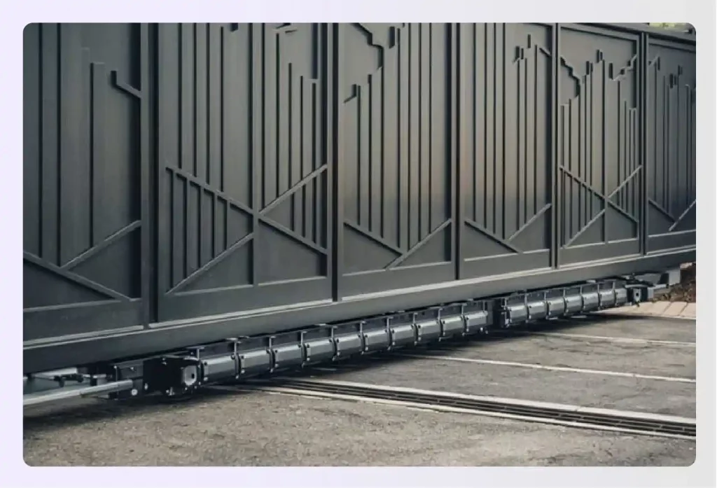 A close-up of a decorative black sliding gate mechanism