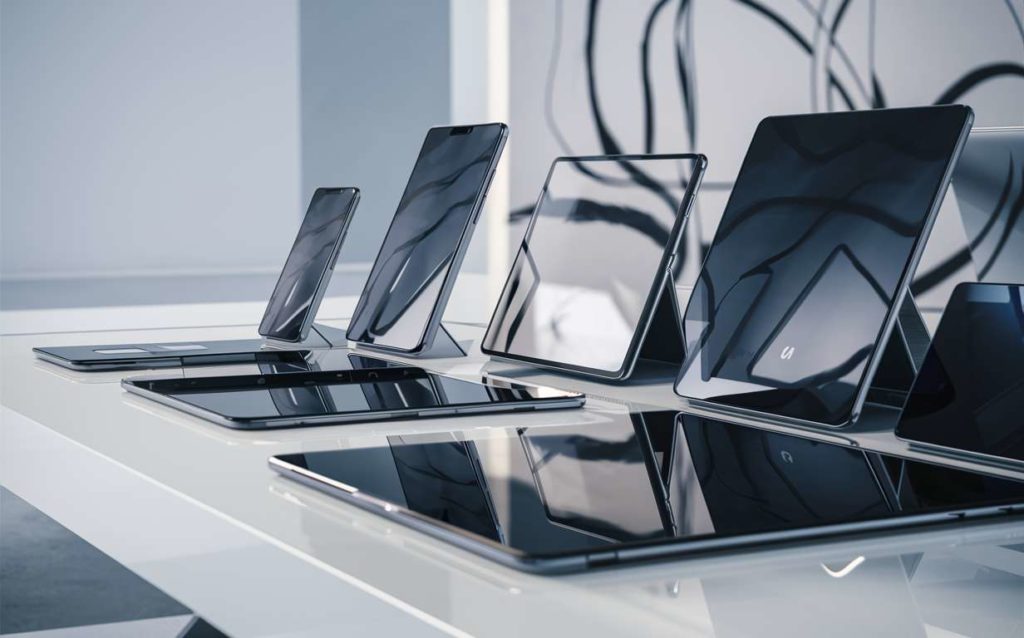 Stacked tablets on white table in office