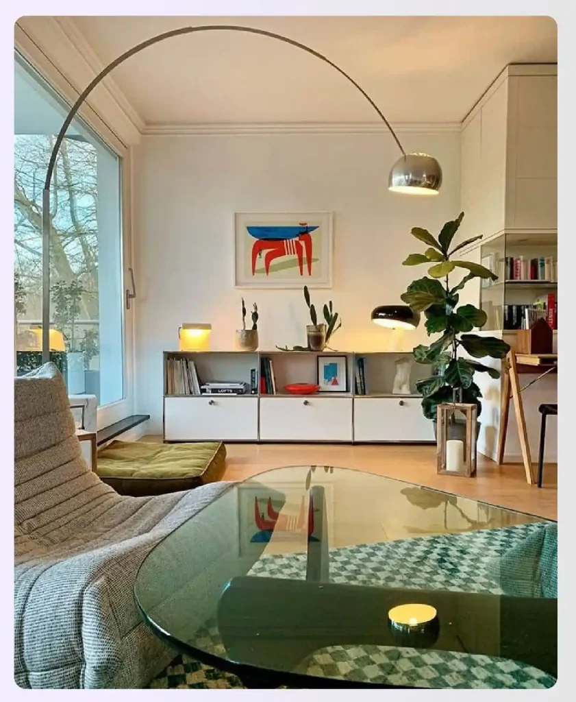 A room with large windows and stylish modern lamps