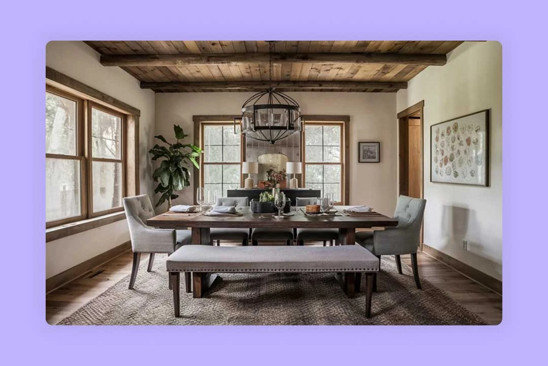 A well-lit dining room with a wooden table set for a meal.