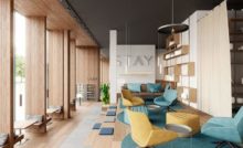 Communal workspace with ergonomic furniture in a co-living environment