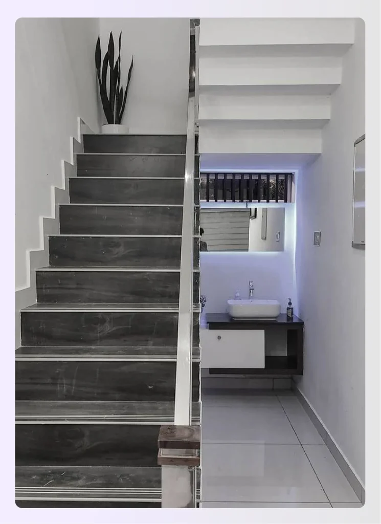 Under-stairs compact bathroom layout