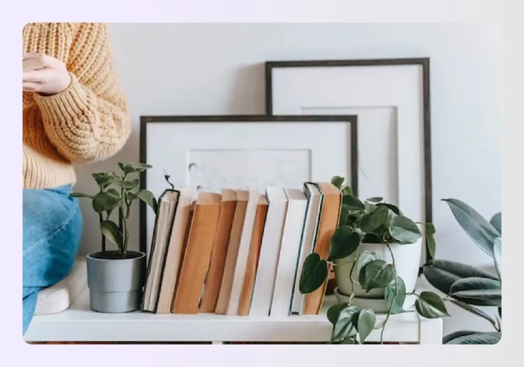 Indoor potted plants next to books
