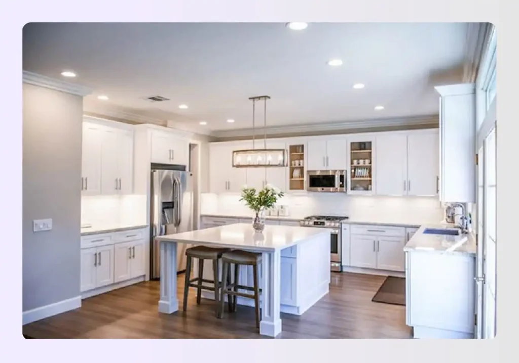 White kitchen island with modern lighting White kitchen island with modern lighting
